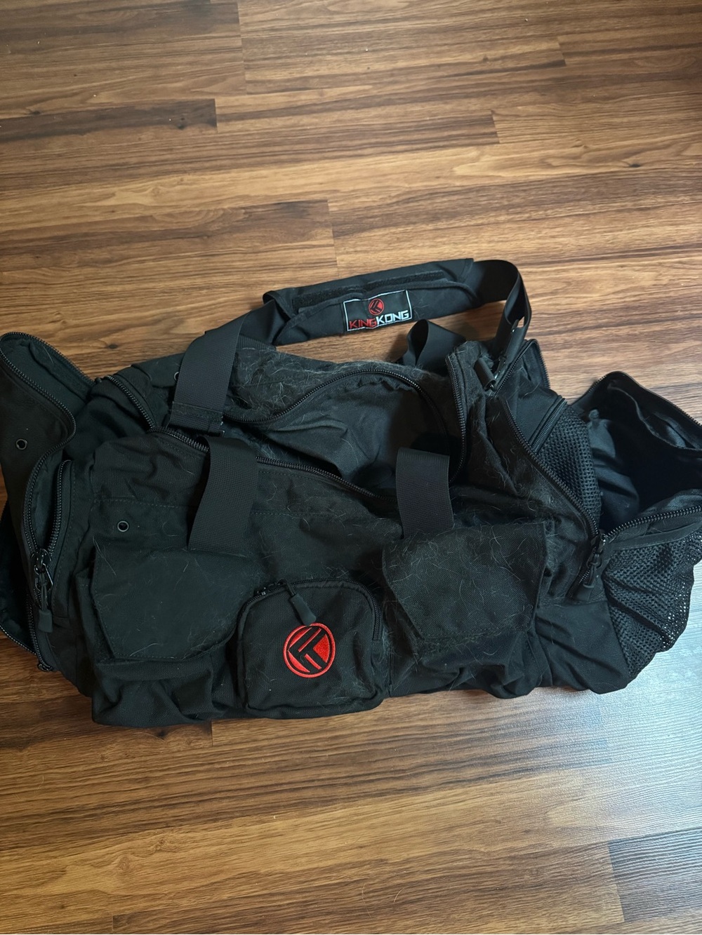 Black Men's Duffel Bag with Red Logo Accent